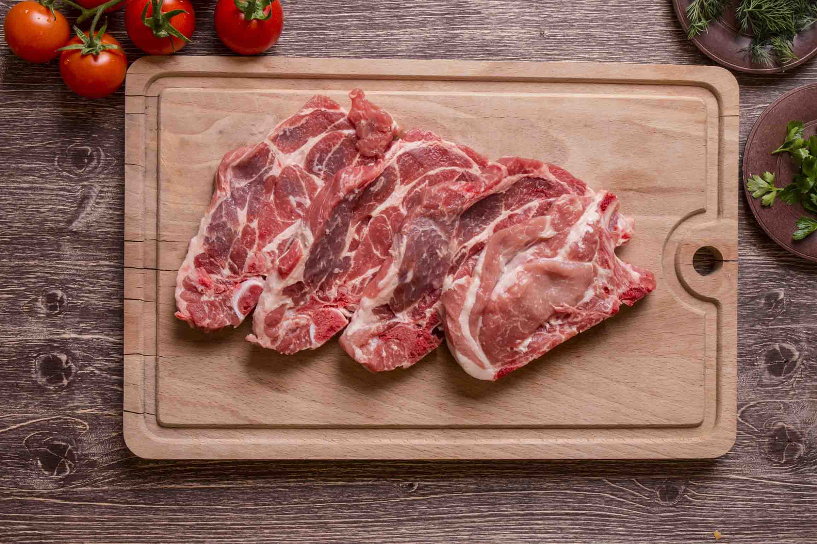 Non-GMO Pastured pork chops steaks country ribs bone in organically raised glyphosate-free soy free gluten free celiac crones disease gut health grass Northstar Bison as nature intended wild hog